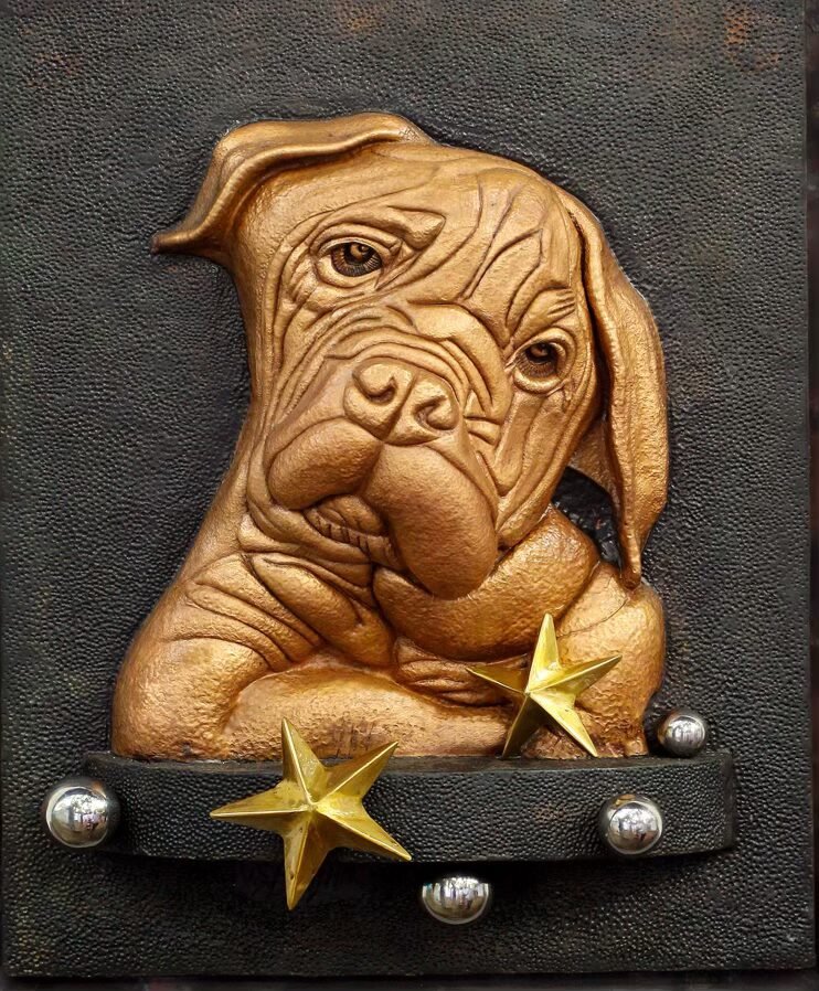 My Puppy and Her Toys — embossed copper relief of a dog