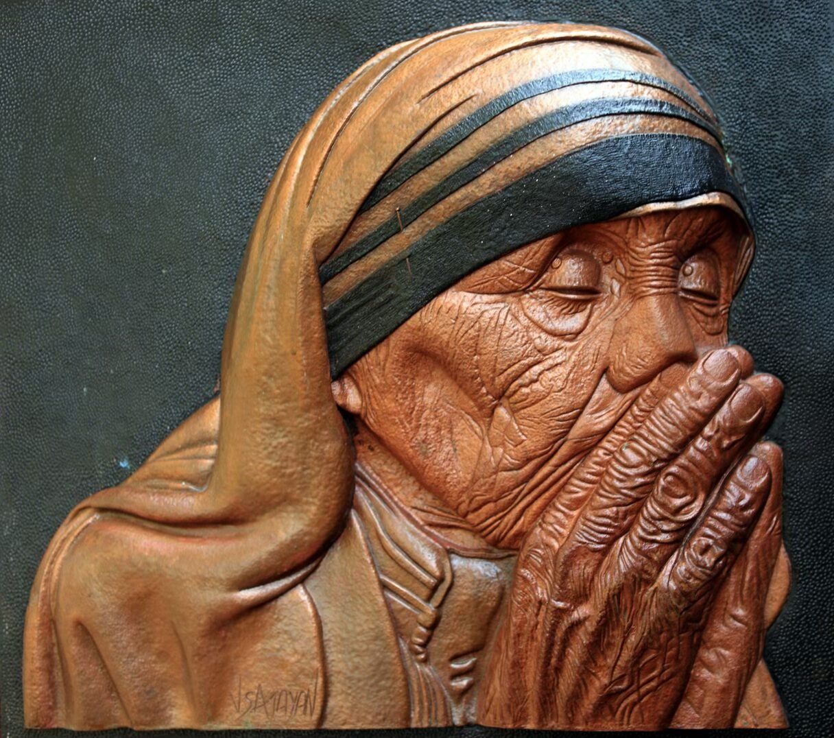 Praying Mother — embossed copper relief